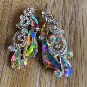 These earrings have never been worn they are a little long an bulky